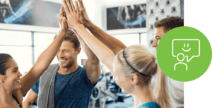 Participants giving a high five after a fitness workshop