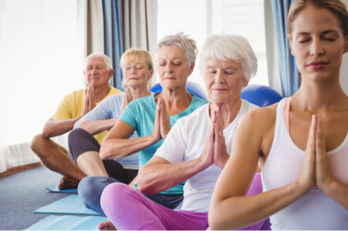 A group of seniors practicing yoga